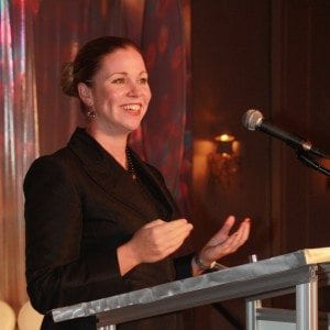Krista Speaking at Podium 300x300 1